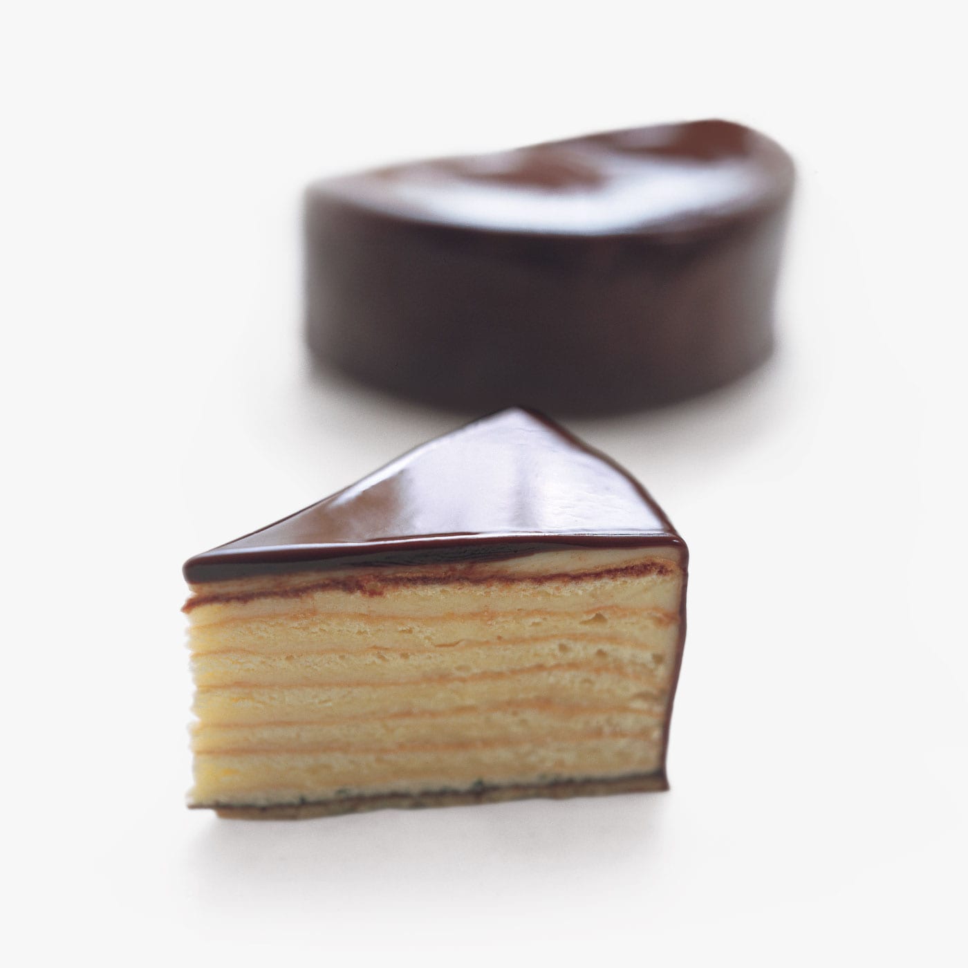 Chocolate Lemon Cake. Traditional German "Herrentorte." 11 layers of sponge cake and lemon cream are glazed in Burdick's signature dark chocolate.